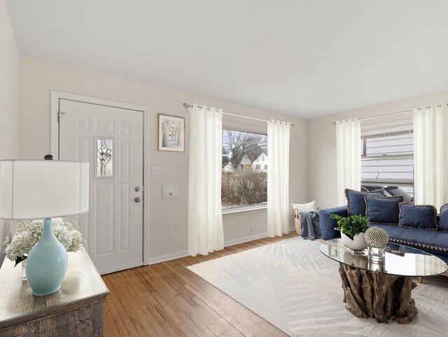7509 W Burleigh St, Milwaukee, WI 53210 - living room featuring light wood-style flooring and baseboards