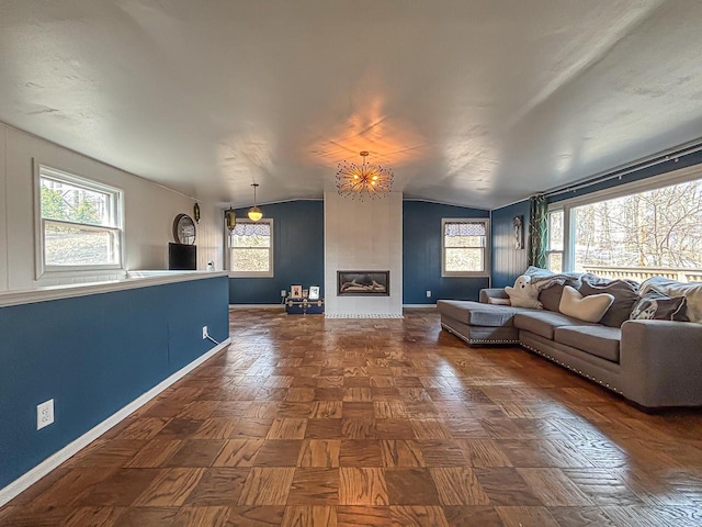 825 Post Rd, Brookfield, WI 53005 - living room with baseboards, a chandelier, and plenty of natural light