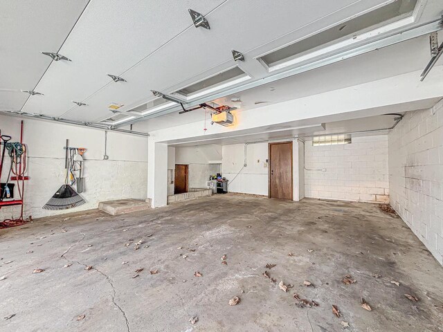825 Post Rd, Brookfield, WI 53005 - garage featuring a garage door opener