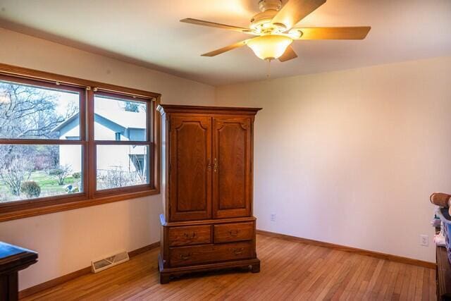 9506 296th Ave, Salem, WI 53168 - bedroom featuring baseboards, a ceiling fan, visible vents, and light wood-type flooring