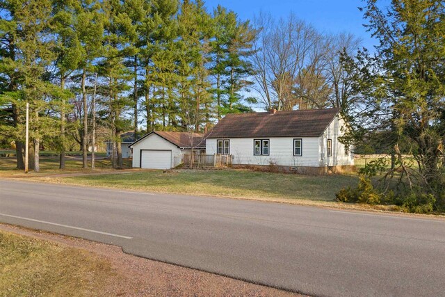 771 Seneca Rd, Wisconsin Rapids, WI 54495 - view of front of house with a front lawn and an outbuilding