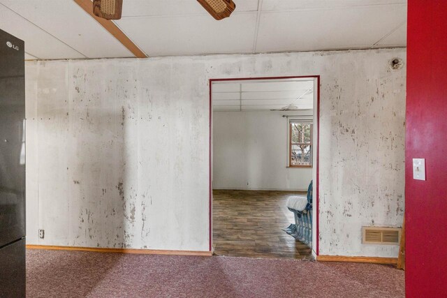 771 Seneca Rd, Wisconsin Rapids, WI 54495 - carpeted empty room with wood finished floors, a ceiling fan, and visible vents