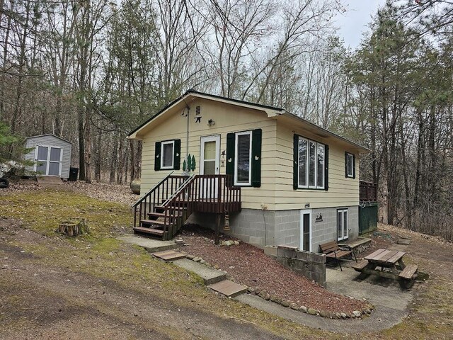 W5691 Cedar Trl, Neshkoro, WI 54960 - view of front of property featuring an outbuilding and a shed