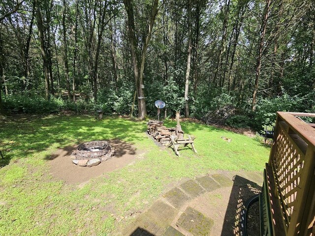 W5691 Cedar Trl, Neshkoro, WI 54960 - view of yard featuring an outdoor fire pit