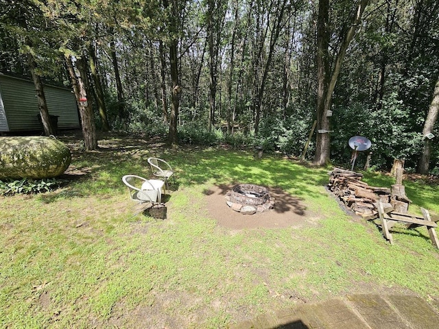 W5691 Cedar Trl, Neshkoro, WI 54960 - view of yard featuring an outdoor fire pit