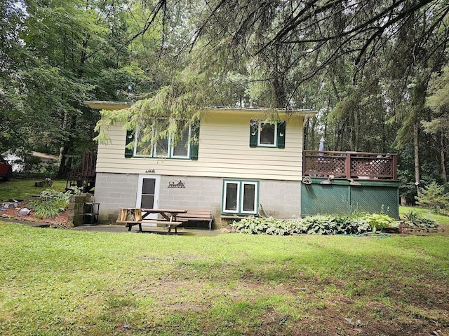 W5691 Cedar Trl, Neshkoro, WI 54960 - rear view of house with a wooden deck and a yard