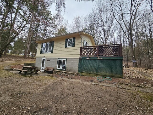 W5691 Cedar Trl, Neshkoro, WI 54960 - back of property featuring a deck