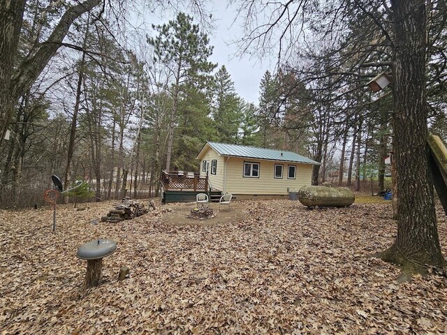 W5691 Cedar Trl, Neshkoro, WI 54960 - exterior space with a wooden deck and metal roof