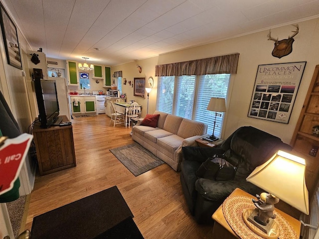 W5691 Cedar Trl, Neshkoro, WI 54960 - living area with an inviting chandelier, crown molding, and light wood-type flooring