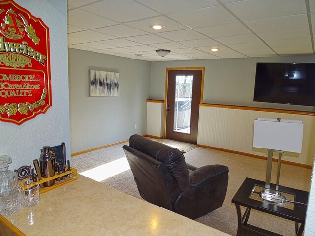 N1698 945th St, Eau Claire, WI 54701 - living area featuring wainscoting, baseboards, carpet flooring, and a paneled ceiling