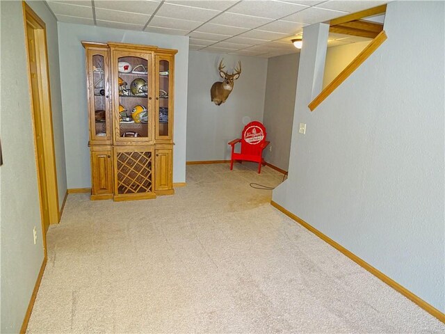N1698 945th St, Eau Claire, WI 54701 - playroom featuring a paneled ceiling, baseboards, and light carpet