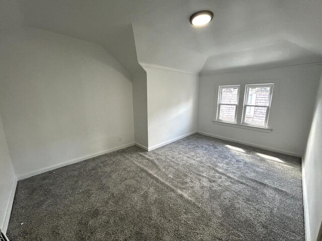 4271 N 26th St, Milwaukee, WI 53209 - bonus room with lofted ceiling, baseboards, and carpet floors