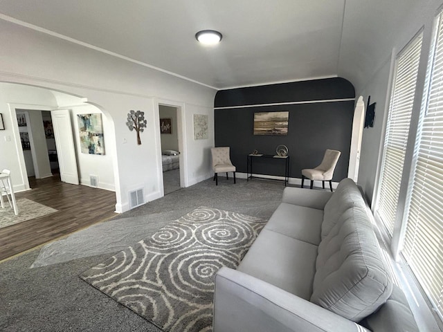 4271 N 26th St, Milwaukee, WI 53209 - living room featuring baseboards, arched walkways, visible vents, and plenty of natural light