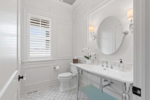 6916 N Palladium Ct, Appleton, WI 54913 - half bath with a decorative wall and toilet