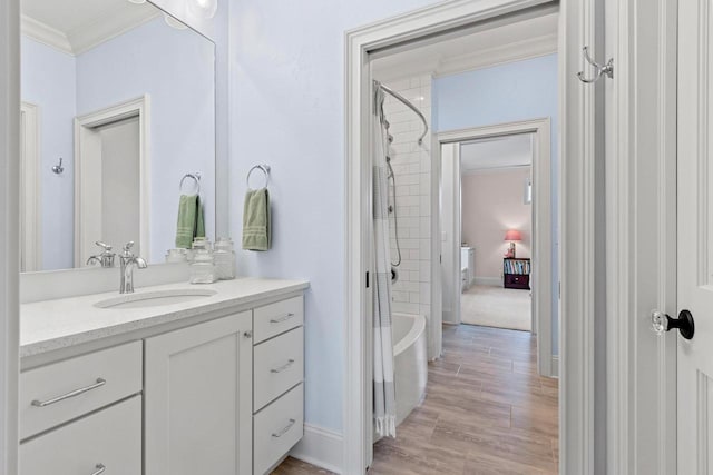 6916 N Palladium Ct, Appleton, WI 54913 - full bathroom featuring ornamental molding, vanity, wood finished floors, shower / bath combo, and baseboards