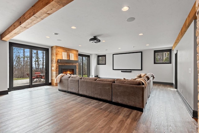 6916 N Palladium Ct, Appleton, WI 54913 - cinema with wood finished floors, a lit fireplace, recessed lighting, baseboards, and beam ceiling