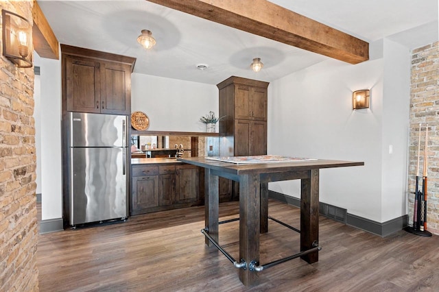 6916 N Palladium Ct, Appleton, WI 54913 - kitchen featuring freestanding refrigerator, wood finished floors, beam ceiling, a sink, and baseboards