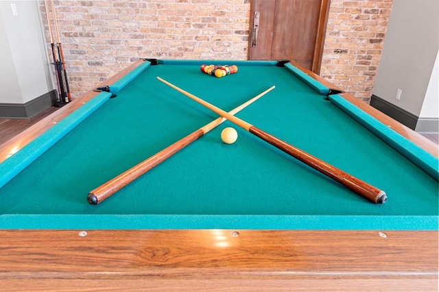 6916 N Palladium Ct, Appleton, WI 54913 - detailed view of brick wall, baseboards, and pool table