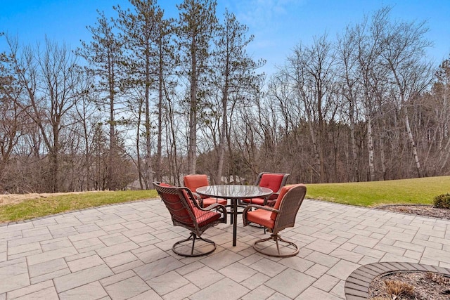 6916 N Palladium Ct, Appleton, WI 54913 - view of patio featuring outdoor dining space and a forest view