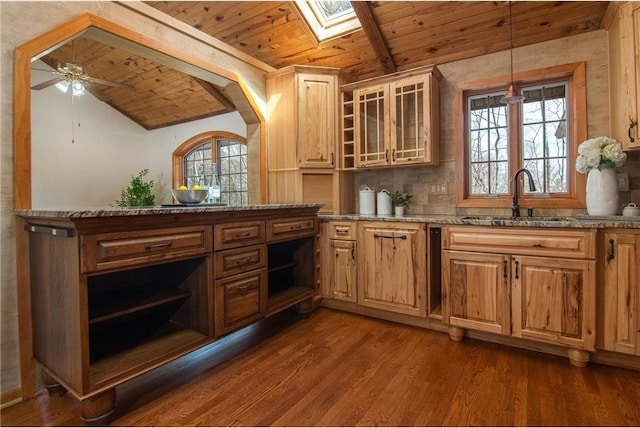 840 Park Dr, Balsam Lake, WI 54810 - bar featuring wooden ceiling, a sink, dark wood-type flooring, lofted ceiling with skylight, and decorative light fixtures