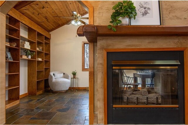 840 Park Dr, Balsam Lake, WI 54810 - interior space with a glass covered fireplace, wooden ceiling, baseboards, and a ceiling fan