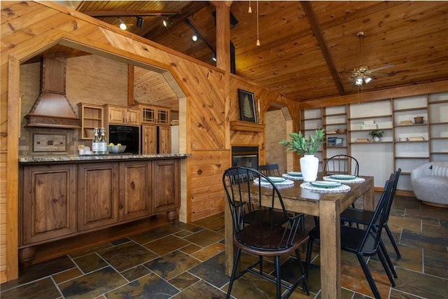 840 Park Dr, Balsam Lake, WI 54810 - dining space featuring wood ceiling, a ceiling fan, and stone tile flooring