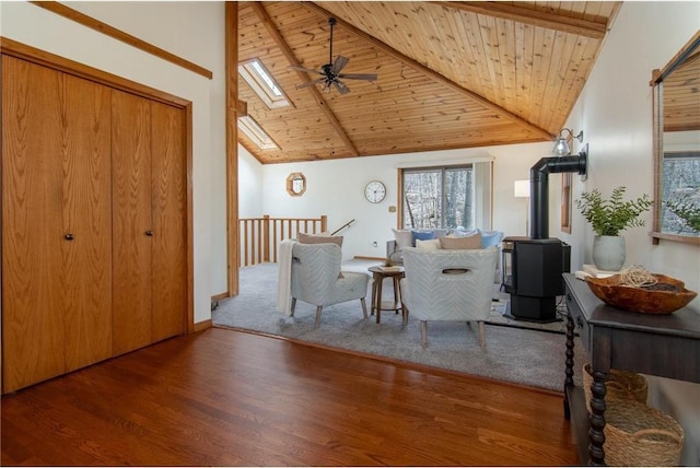 840 Park Dr, Balsam Lake, WI 54810 - living room with wood finished floors, a ceiling fan, beamed ceiling, a skylight, and wood ceiling