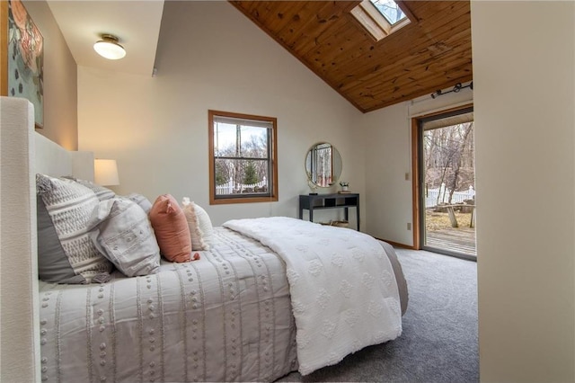 840 Park Dr, Balsam Lake, WI 54810 - bedroom with baseboards, carpet, vaulted ceiling with skylight, access to outside, and wood ceiling
