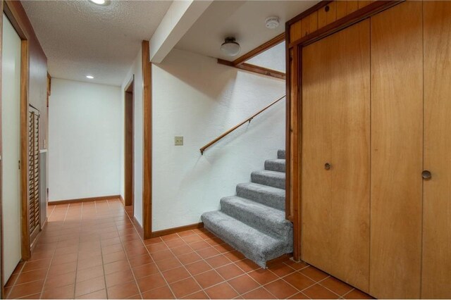 840 Park Dr, Balsam Lake, WI 54810 - stairs with recessed lighting, a textured ceiling, and baseboards
