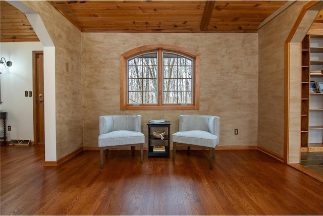 840 Park Dr, Balsam Lake, WI 54810 - living area with baseboards, wood finished floors, arched walkways, and wood ceiling