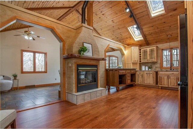 840 Park Dr, Balsam Lake, WI 54810 - unfurnished living room featuring a skylight, plenty of natural light, and wooden ceiling