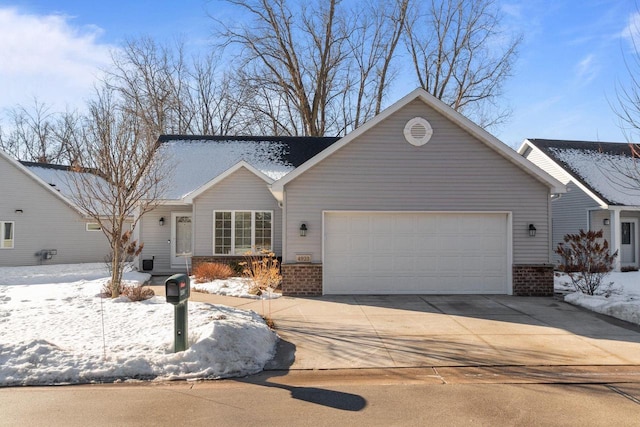 4923 W Woods Creek Ln, Appleton, WI 54913 - ranch-style house with concrete driveway, brick siding, and a garage