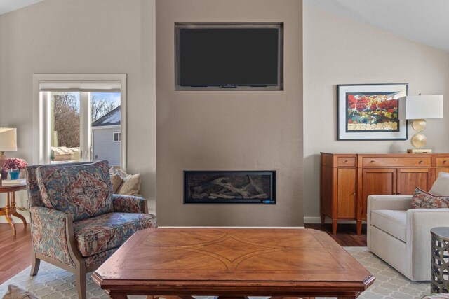 4923 W Woods Creek Ln, Appleton, WI 54913 - living area with light wood-style flooring, a glass covered fireplace, and vaulted ceiling