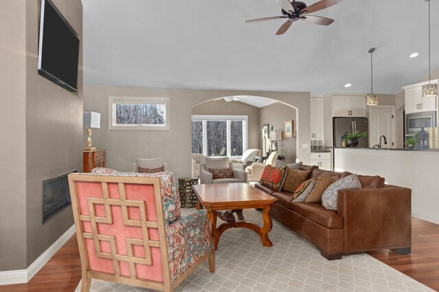 4923 W Woods Creek Ln, Appleton, WI 54913 - living room featuring recessed lighting, arched walkways, ceiling fan, and light wood finished floors