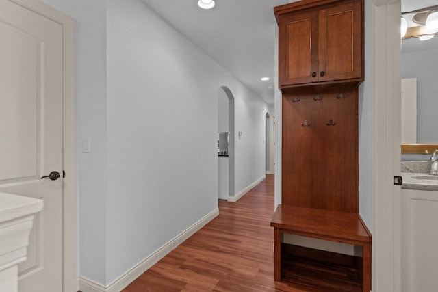 4923 W Woods Creek Ln, Appleton, WI 54913 - interior space with a sink, light wood-style floors, baseboards, recessed lighting, and arched walkways