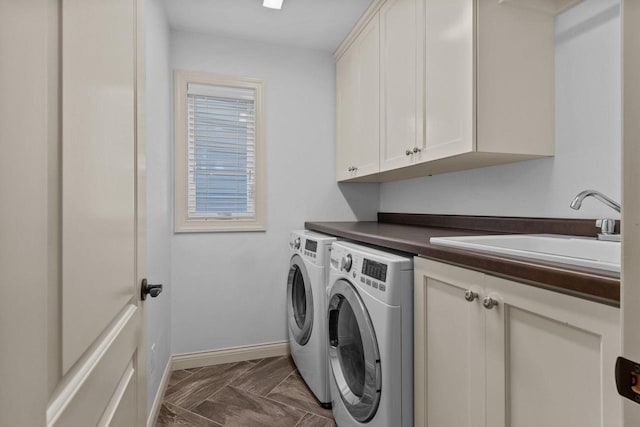 4923 W Woods Creek Ln, Appleton, WI 54913 - washroom with a sink, baseboards, cabinet space, and washer and dryer