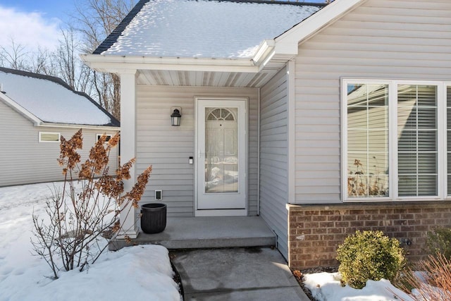 4923 W Woods Creek Ln, Appleton, WI 54913 - snow covered property entrance with brick siding