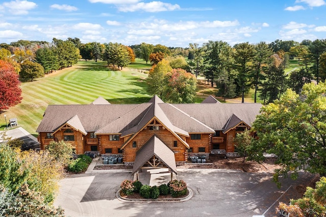 birds eye view of property with golf course view