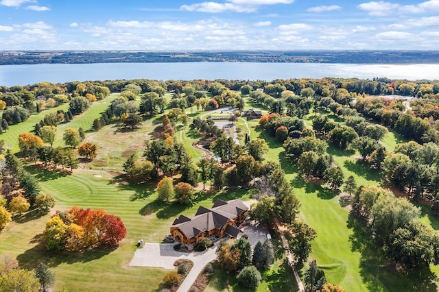 aerial view with golf course view and a water view