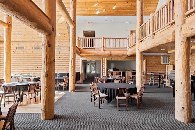 view of patio with outdoor dining area, visible vents, and a balcony