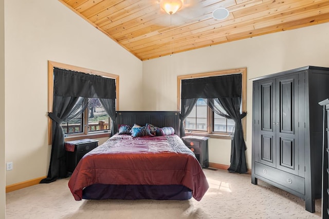 bedroom featuring wood ceiling, lofted ceiling, multiple windows, and light colored carpet