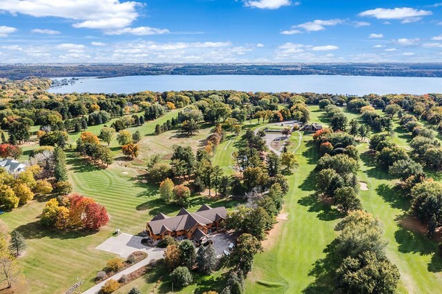birds eye view of property featuring golf course view and a water view