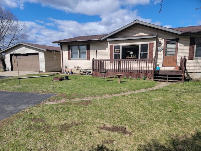 S5026 Greenfield Ln, Baraboo, WI 53913 - ranch-style home with a detached garage, a front lawn, and concrete driveway