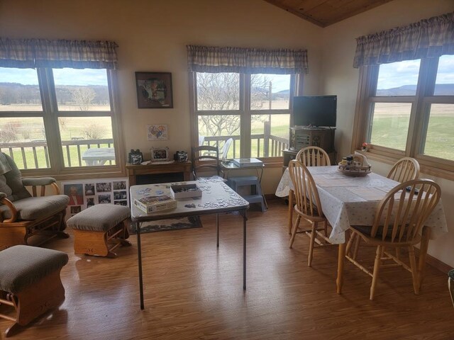 S5026 Greenfield Ln, Baraboo, WI 53913 - dining room featuring vaulted ceiling and wood finished floors