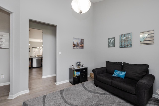 living room featuring wood finished floors and baseboards