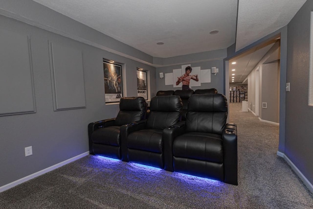 home theater featuring carpet flooring and baseboards