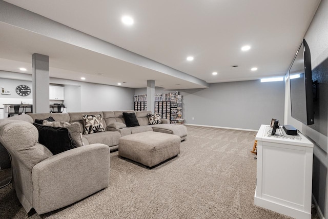 living area with light carpet, baseboards, and recessed lighting