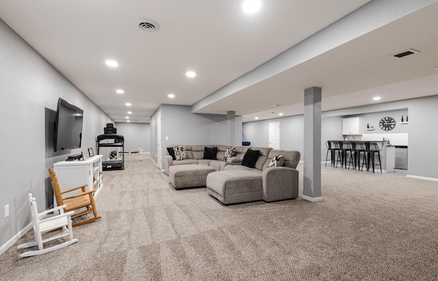 living room with recessed lighting, carpet, visible vents, and baseboards