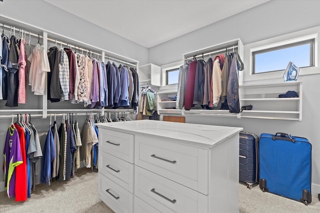 walk in closet featuring carpet floors