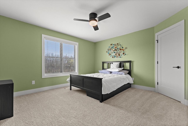 bedroom featuring baseboards, carpet flooring, and a ceiling fan